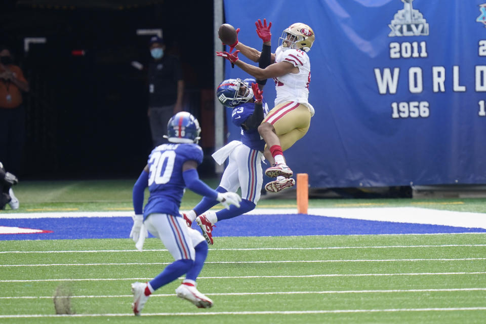 San Francisco 49ers' Jordan Reed, right, tries to grab a pass over New York Giants' Logan Ryan during the first half of an NFL football game, Sunday, Sept. 27, 2020, in East Rutherford, N.J. (AP Photo/Corey Sipkin)