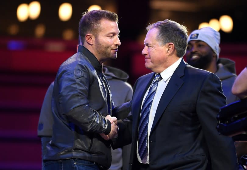 ATLANTA GEORGIA JANUARY 28, 2019-Rams head coach Sean McVay, left, and Patriots head coach Bill Belichick meet on stage during media day in Atlanta Monday. (Wally Skalij/Los Angeles Times)