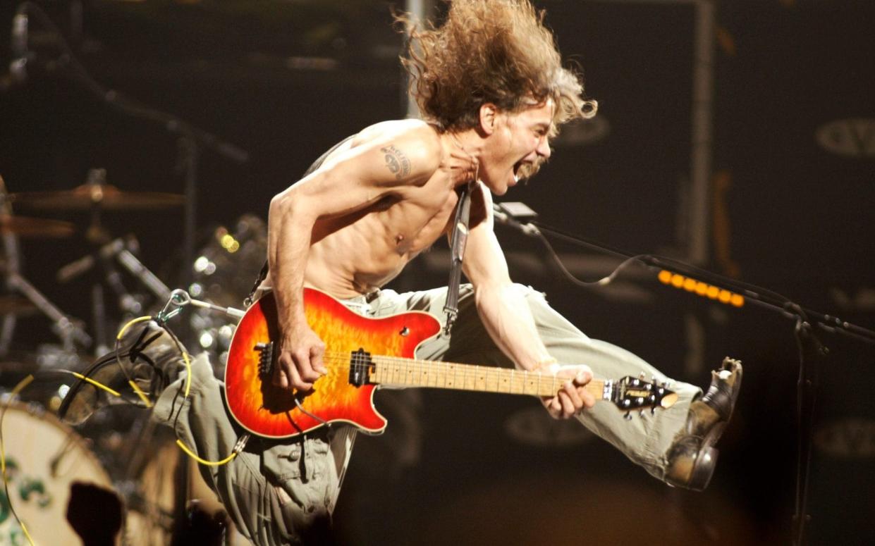 Eddie Van Halen playing the final chord of Jump in 2004 - AP