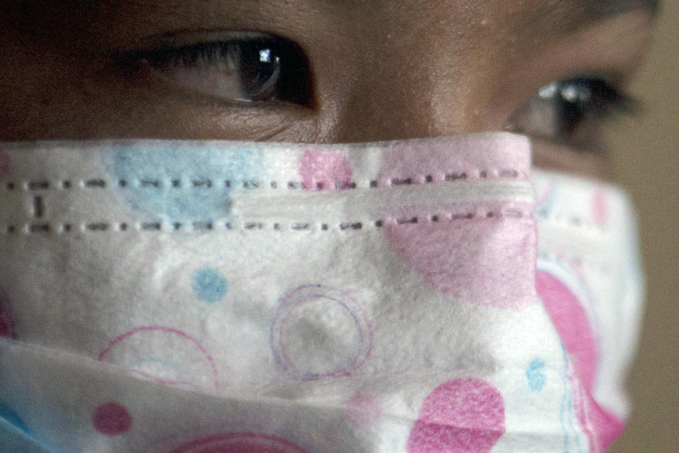 Ima, a girl who works informally to help her parents in a palm oil plantation, poses for a portrait in Sumatra, Indonesia, Sunday, Sept. 9, 2018. She was just 10 years old when she joined the throngs of children working on vast plantations in Indonesia and Malaysia, which supply 85% of the world's palm oil, used in a dizzying array of products sold by leading Western food and cosmetics brands. (AP Photo/Binsar Bakkara)