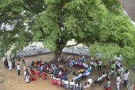 People take part in a meeting of the Village Monitoring Committee of Amritpur Village, Uttar Pradesh state, India, on June 10, 2021. India's vaccination efforts are being undermined by widespread hesitancy and fear of the jabs, fueled by misinformation and mistrust. That's especially true in rural India, where two-thirds of the country’s nearly 1.4 billion people live. (AP Photo/Rajesh Kumar Singh)