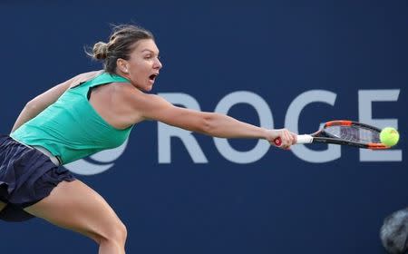 Aug 10, 2018; Montreal, Quebec, Canada; Simona Halep of Romania hits a shot against Caroline Garcia of France (not pictured) during the Rogers Cup tennis tournament at Stade IGA. Mandatory Credit: Jean-Yves Ahern-USA TODAY Sports
