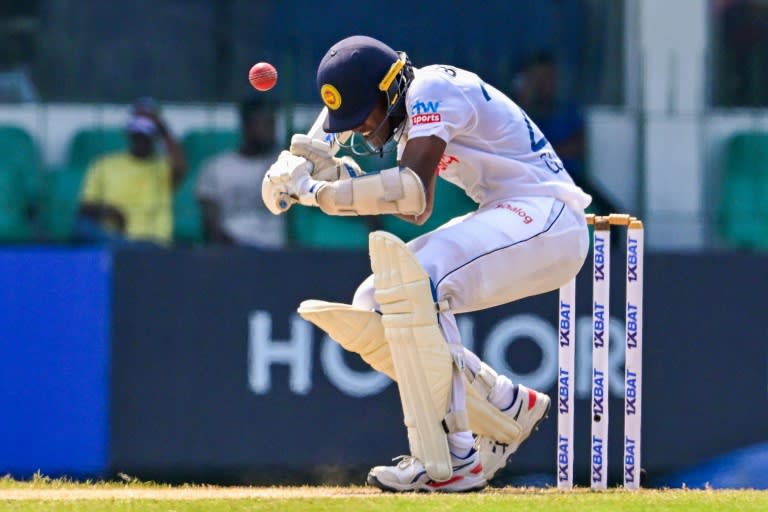 Sri Lanka's Chamika Gunasekara avoids a bouncer during the third day of the one-off Test cricket match between Sri Lanka and Afghanistan (Ishara S. KODIKARA)