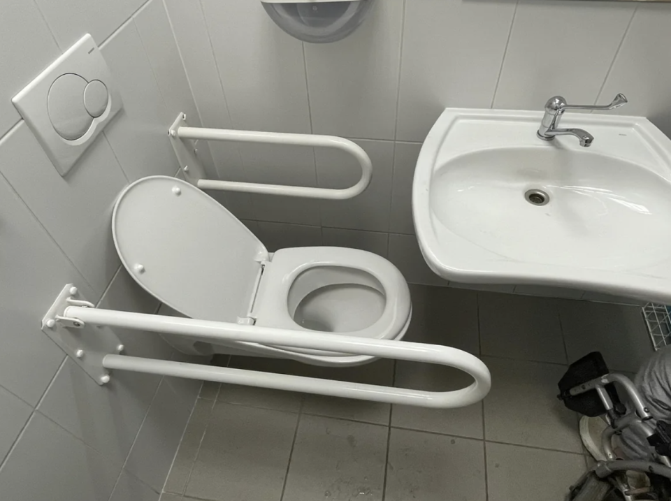 sink completely blocking access to the toilet
