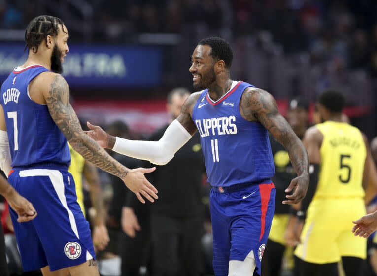 Los Angeles, CA - November 21:Clippers guard Amir Coffey, left, congratulates Clippers point guard John Wall after he scored a basket in the first half at Crypto.com Arena in Los Angeles Monday, Nov. 21, 2022. (Allen J. Schaben / Los Angeles Times)