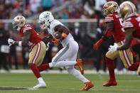 Miami Dolphins wide receiver Trent Sherfield, middle, runs toward the end zone to score against the San Francisco 49ers during the first half of an NFL football game in Santa Clara, Calif., Sunday, Dec. 4, 2022. (AP Photo/Jed Jacobsohn)