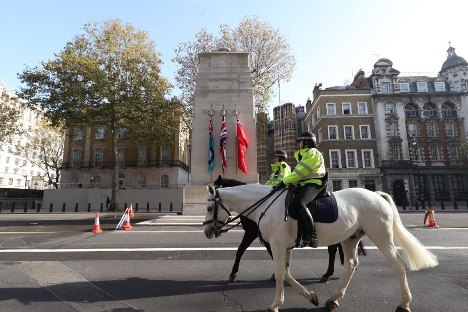 Metropolitan Police on horseback riding past the Cenotaph (PA Archive)