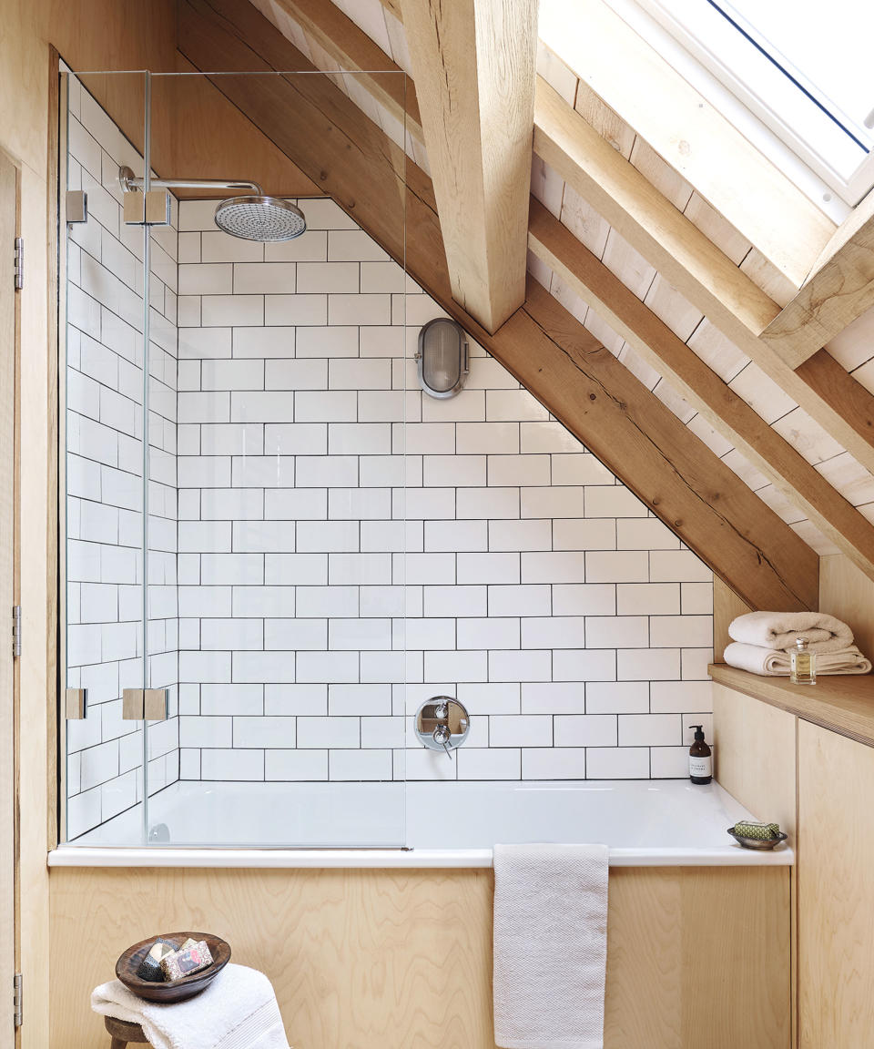 bathroom with pale wood and white tiles