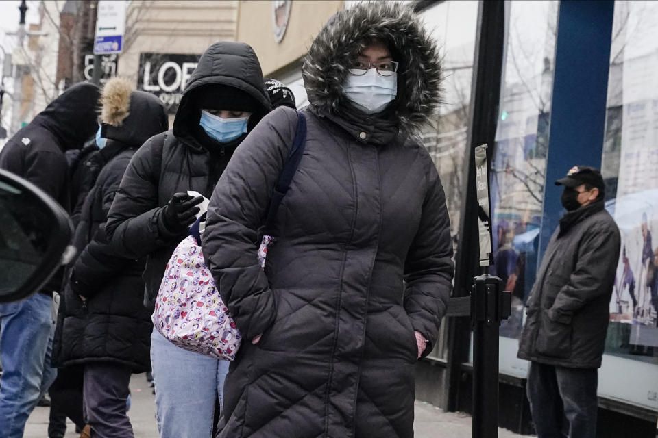 People wait on a line for COVID-19 testing at a CityMD Urgent Care location Wednesday, Dec. 16, 2020, in the Forest Hills neighborhood of the Queens borough of New York. (AP Photo/Frank Franklin II)