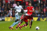 West Ham United's Mohamed Diame (left) and Southampton's Victor Wanyama battle for the ball