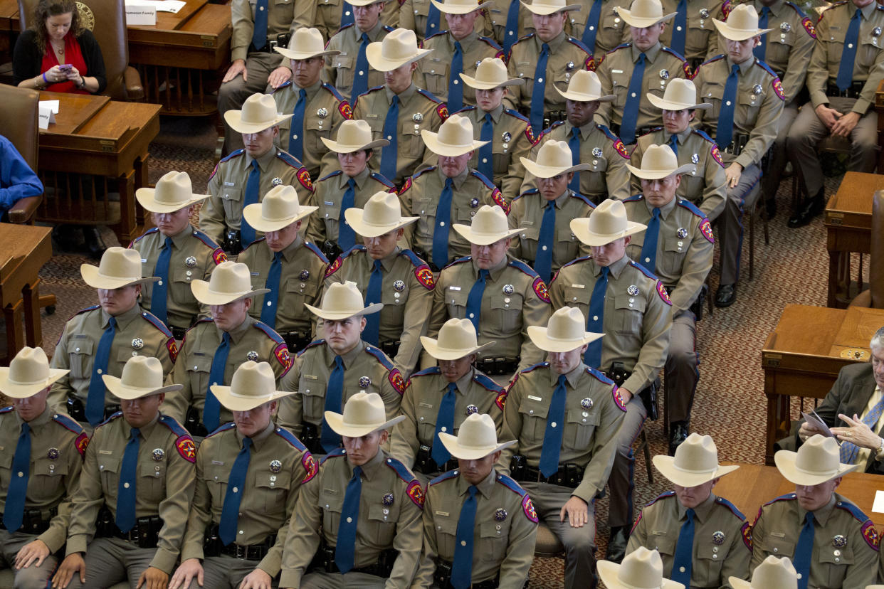 Texas Department of Public Safety (DPS) commissions a class of 74 new state troopers at the Texas Capitol following 21 weeks of training in counter-terrorism, traffic and criminal law and arrest procedures. (Photo by Robert Daemmrich Photography Inc/Corbis via Getty Images)