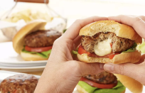 <p>These chicken burgers are full of fresh Italian flavors — fresh basil and ripe tomatoes — and stuffed with creamy mozzarella.</p> <p><a href="https://www.thedailymeal.com/best-recipes/caprese-stuffed-chicken-burgers?referrer=yahoo&category=beauty_food&include_utm=1&utm_medium=referral&utm_source=yahoo&utm_campaign=feed" rel="nofollow noopener" target="_blank" data-ylk="slk:For the Caprese-Stuffed Chicken Burgers recipe, click here.;elm:context_link;itc:0;sec:content-canvas" class="link ">For the Caprese-Stuffed Chicken Burgers recipe, click here. </a></p>