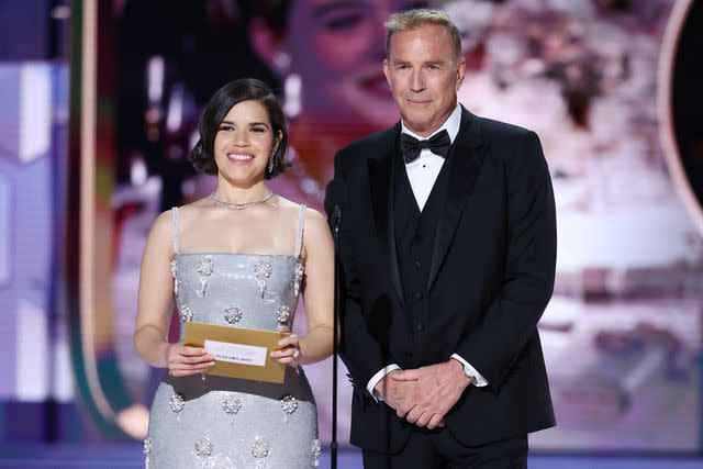 <p>Rich Polk/Getty</p> America Ferrera and Kevin Costner at the 81st Golden Globe Awards