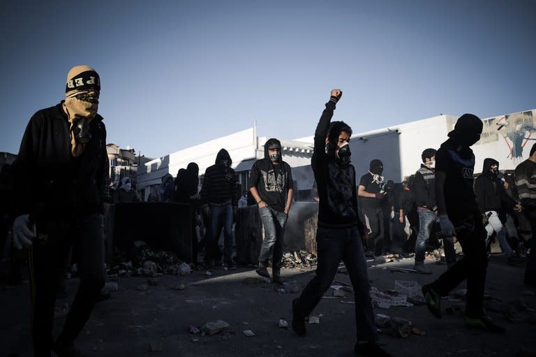 Shiite protestors clash with security forces following a protest to mark the second anniversary of an uprising in the Sunni-ruled kingdom of Bahrain in Sanabis on February 14, 2013. Bahrain's opposition called a rally near Manama marking the second anniversary of a Shiite-led uprising against the kingdom's Sunni rulers, a day after two people died when protests turned violent