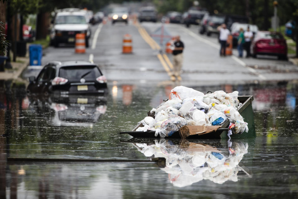 A dumpster floats on floodwater along Broadway in Westville, N.J. Thursday, June 20, 2019. Severe storms containing heavy rains and strong winds spurred flooding across southern New Jersey, disrupting travel and damaging some property. (Photo: Matt Rourke/AP)