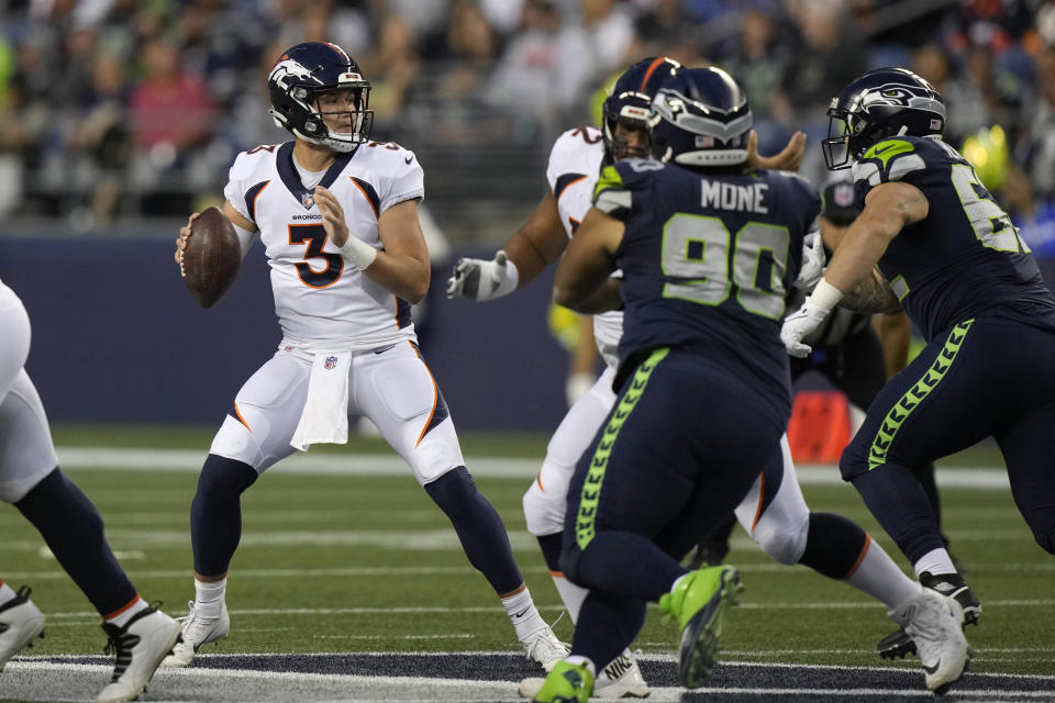 Denver Broncos quarterback Drew Lock (3) drops to pass against the Seattle Seahawks during the first half of an NFL preseason football game Saturday, Aug. 21, 2021, in Seattle. (AP Photo/Stephen Brashear)