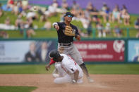 Minnesota Twins center fielder Michael A. Taylor (2) is forced out as New York Yankees second baseman Anthony Volpe throws to first on a double play off the bat of Andrew Bechtold in the fifth inning of a spring training baseball game in Fort Myers, Fla., Monday, March 13, 2023. (AP Photo/Gerald Herbert)