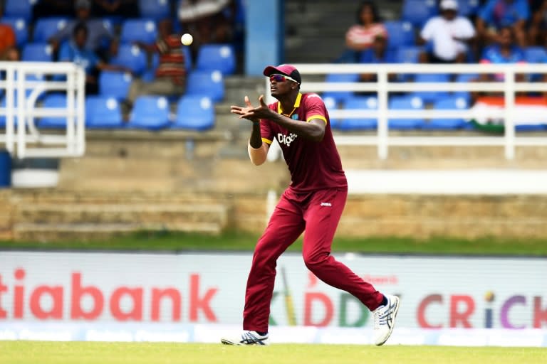 West Indies' captain Jason Holder takes a catch to dismiss India's Ajinkya Rahane during the first One Day International (ODI) match between West Indies and India at the Queen's Park Oval in Port of Spain, Trinidad, on June 23, 2107