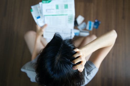 <span class="caption">After the pandemic, borrowing is set to skyrocket. </span> <span class="attribution"><a class="link " href="https://www.shutterstock.com/image-photo/top-view-stressed-young-asian-woman-1262614678" rel="nofollow noopener" target="_blank" data-ylk="slk:Hananeko_Studio;elm:context_link;itc:0;sec:content-canvas">Hananeko_Studio</a></span>