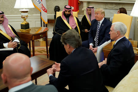 U.S. President Donald Trump, flanked by ‪Vice President Mike Pence‬, welcomes Saudi Arabia's Crown Prince Mohammed bin Salman in the Oval Office at the White House in Washington, U.S. March 20, 2018. REUTERS/Jonathan Ernst