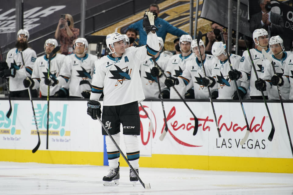 San Jose Sharks center Patrick Marleau (12) waves to the crowd during a small ceremony to mark his passing Gordie Howe for most NHL games played in the first period of an NHL hockey game Monday, April 19, 2021, in Las Vegas. (AP Photo/John Locher)