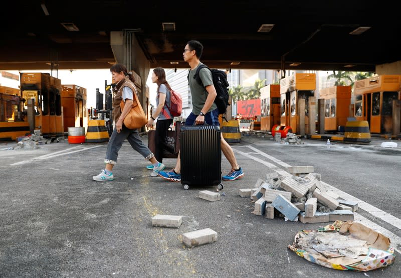 People walk past the Cross Harbour Tunnel near the Polytechnic University in Hong Kong