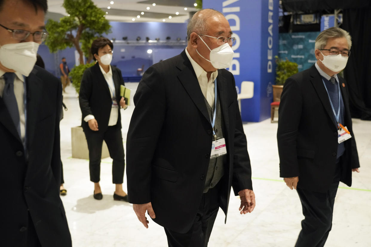 Xie Zhenhua, China's special envoy for climate, walks through the COP27 U.N. Climate Summit, Sunday, Nov. 20, 2022, in Sharm el-Sheikh, Egypt. (AP Photo/Peter Dejong)