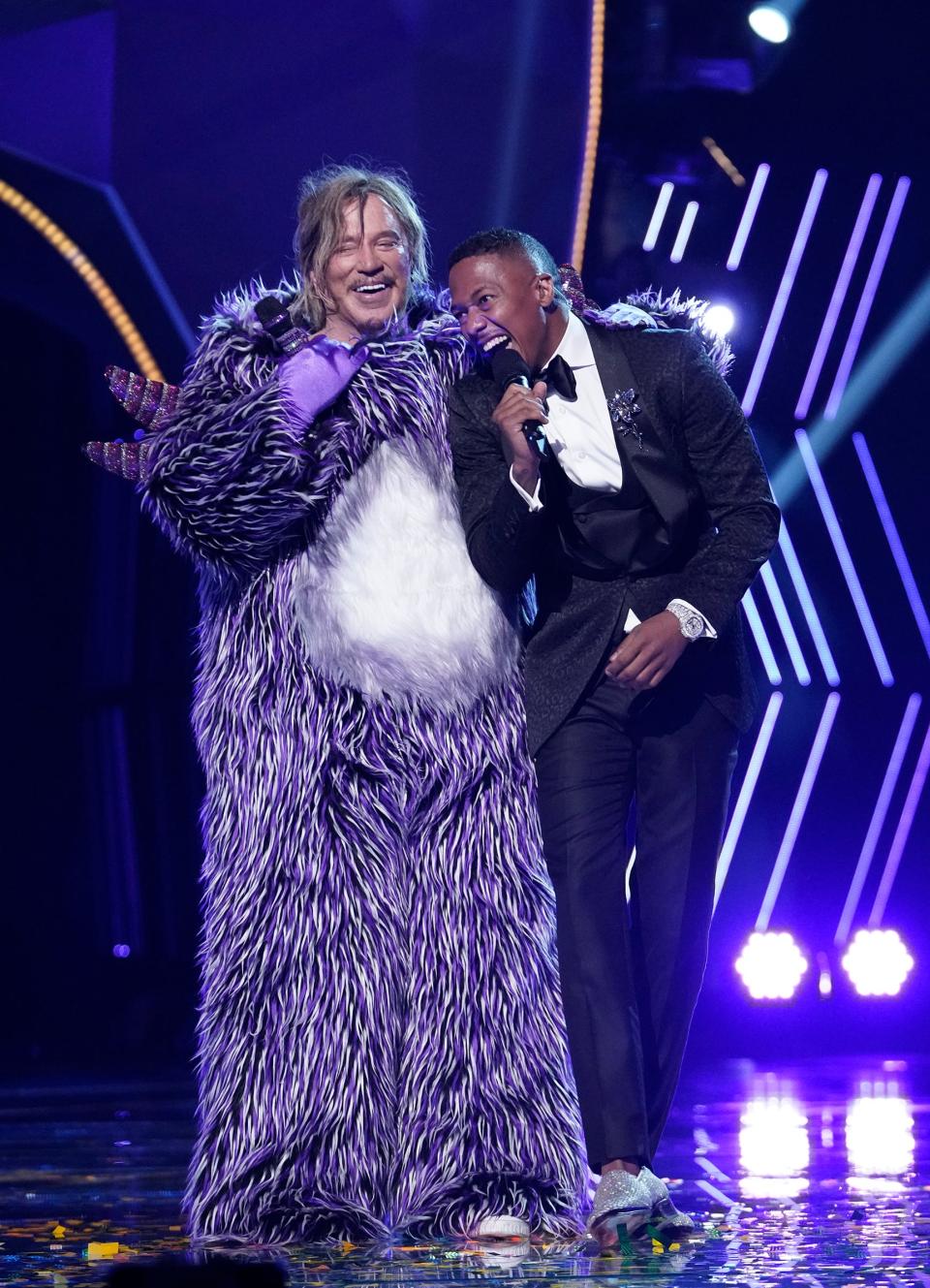 Mickey Rourke and "Masked Singer" host Nick Cannon have a laugh after the Oscar nominee removed his mask of his own volition.