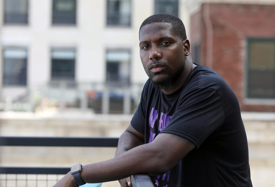 Jahmal Cole, founder and executive director of the community organization My Block, My Hood, My City, poses for a photograph in Chicago, Wednesday, July 22, 2020. The nation's third-largest city is on edge amid a surge in gun violence and protests sparked by the death of George Floyd. Now, Chicago is also awaiting possible greater tension in the form of a plan by President Donald Trump to dispatch dozens of federal agents to the city. Activists say if the agents act as they did recently in Portland, Oregon, it could spark even more violence and attract the kind of agitators who attacked police during a recent downtown protest. (AP Photo/Teresa Crawford)