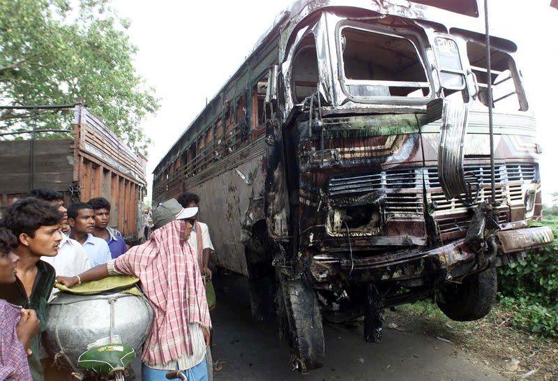 FILE PHOTO: A CRANE LIFTS UP A BUS AFTER AN ACCIDENT IN CALCUTTA.