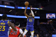 Golden State Warriors forward Jonathan Kuminga (00) shoots against Toronto Raptors forward Chris Boucher (25) during the second half of an NBA basketball game in San Francisco, Friday, Jan. 27, 2023. (AP Photo/Jed Jacobsohn)