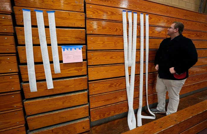 Jordy Mason who is running for Franklin County Central Committee Grove City Ward Two checks voter tally list on Election Day at Grove City Recreation Center in Grove City, Ohio on May 3, 2022. 