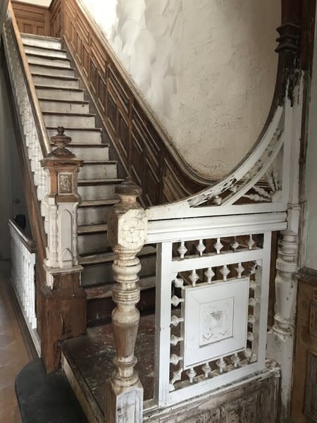Before: The stairs were warped and had to be rebuilt. The contractor removed key historic pieces, like the 