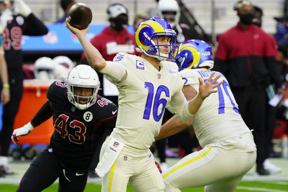 Los Angeles Rams quarterback Jared Goff (16) throws as Arizona Cardinals outside linebacker Haason Reddick (43) pursues during the first half of an NFL football game, Sunday, Dec. 6, 2020, in Glendale, Ariz. (AP Photo/Rick Scuteri)