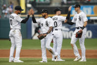 Chicago White Sox's Yoan Moncada (10), Leury Garcia (28), Danny Mendick (20) and Ryan Cordell (49) celebrate after defeating the Detroit Tigers in game one of a baseball doubleheader, Saturday, Sept. 28, 2019, in Chicago. (AP Photo/Kamil Krzaczynski)
