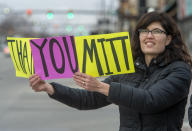 (Rick Egan | The Salt Lake Tribune) Rachel Ligairi holds a sign on Center Street in Provo, during a rally, to thank Mitt Romney for voting to convict President Trump, in the impeachment vote, Wednesday, Feb. 5, 2020./The Salt Lake Tribune via AP)