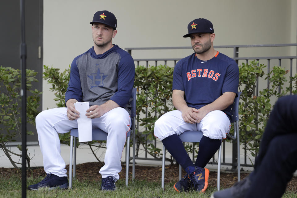 Houston Astros infielder Alex Bregman, left, and teammate Jose Altuve sit in chairs as the wait to deliver statements during a news conference before the start of the first official spring training baseball practice for the team Thursday, Feb. 13, 2020, in West Palm Beach, Fla. (AP Photo/Jeff Roberson) ;