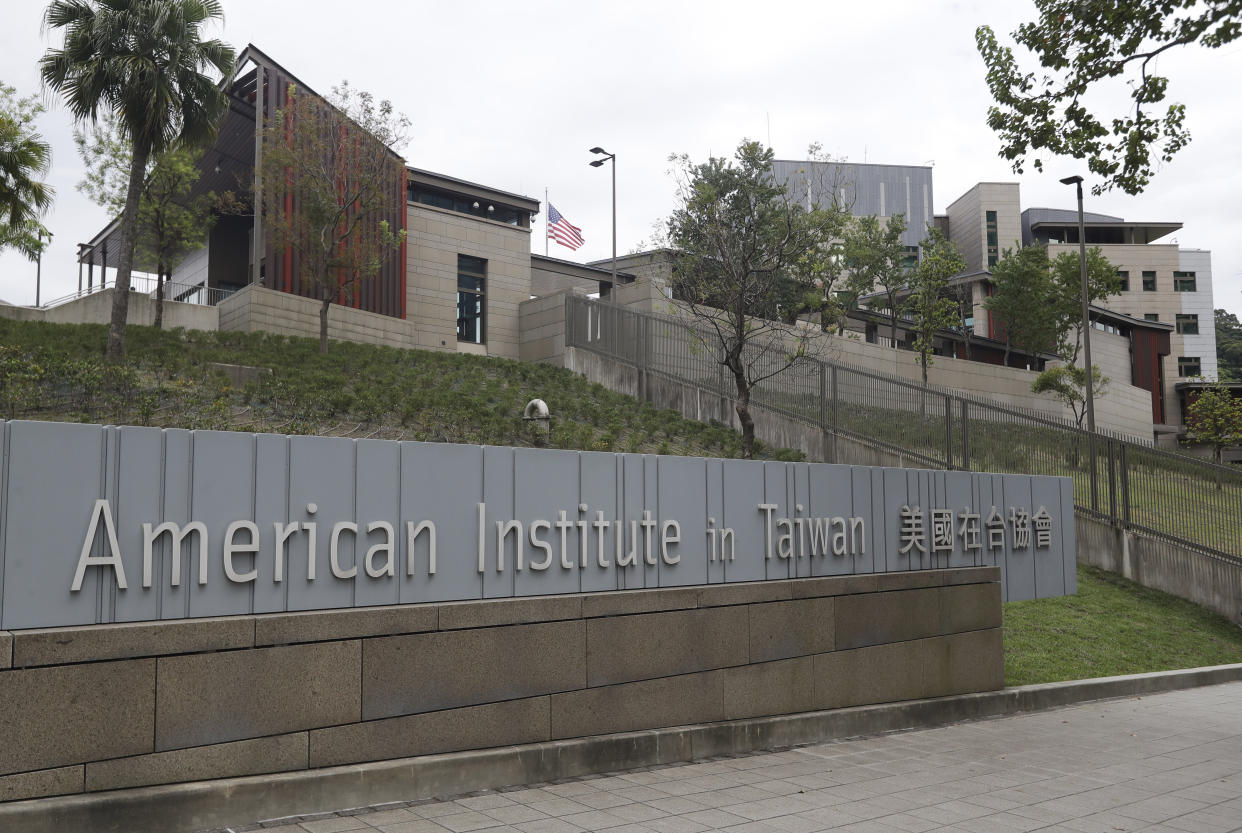 FILE - U.S. flag flutters at American Institute in Taiwan, or AIT in Taipei, Taiwan, Wednesday, Nov. 10, 2021. The U.S. government has announced talks with Taiwan, Thursday, Aug. 18, 2022, on a trade treaty in a new sign of support for the self-ruled island democracy claimed by China’s ruling Communist Party as part of its territory. (AP Photo/Chiang Ying-ying, File)