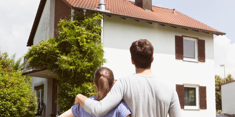 Couple looking at residential house