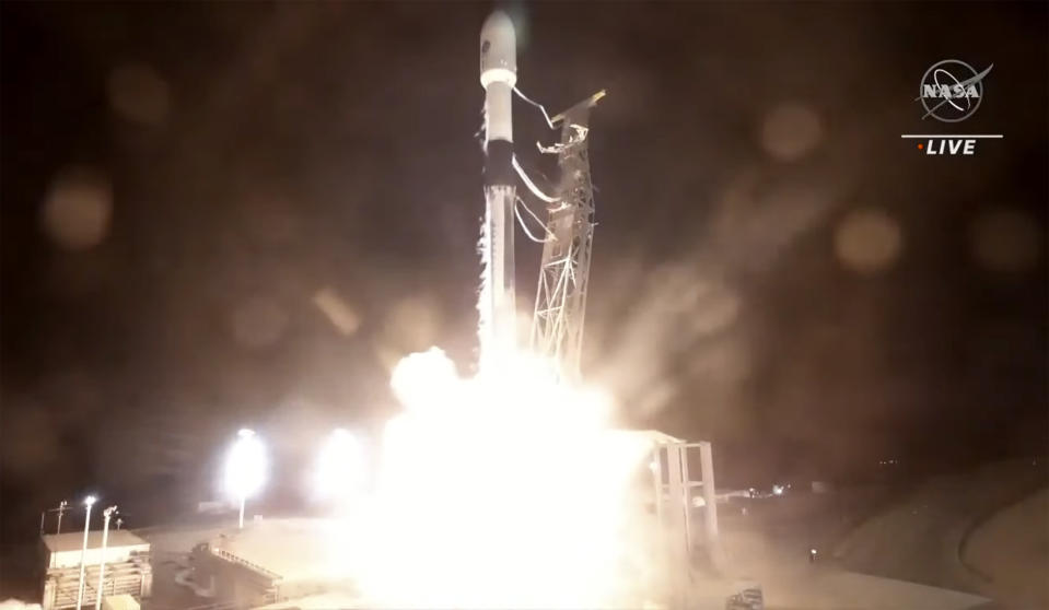 In this image made from video provided by NASA, a SpaceX rocket carrying the Surface Water and Ocean Topography satellite lifts off from Vandenberg Space Force Base in California, Friday, Dec. 16, 2022. (NASA via AP)