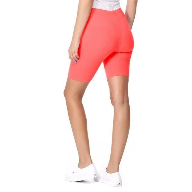 Model wearing high-rise pink bike shorts