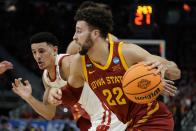 Iowa State's Gabe Kalscheur drives past Wisconsin's Johnny Davis during the first half of a second-round NCAA college basketball tournament game Sunday, March 20, 2022, in Milwaukee. (AP Photo/Morry Gash)