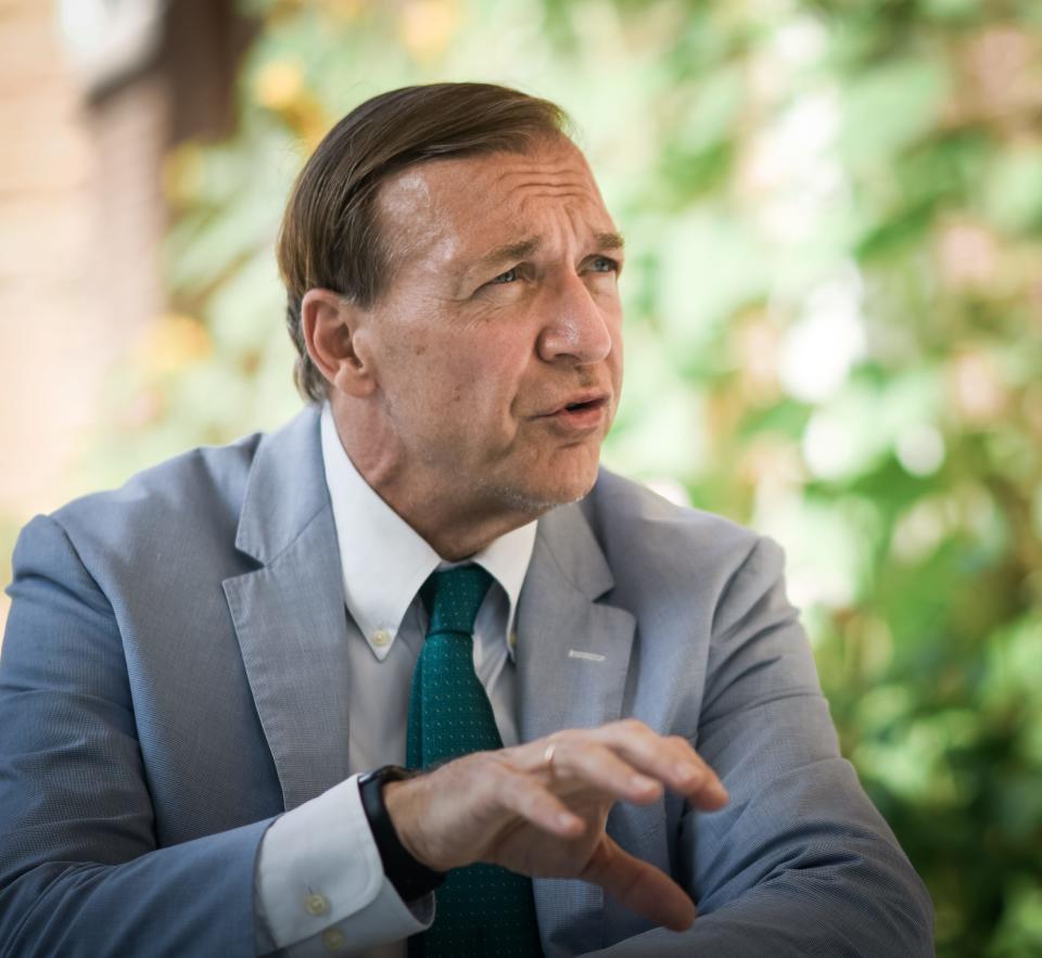 MSU President Samuel L. Stanley Jr., M.D., speaks Monday, Aug. 23, 2021, during an interview on the back porch of the Cowles House on the campus of  Michigan State University.