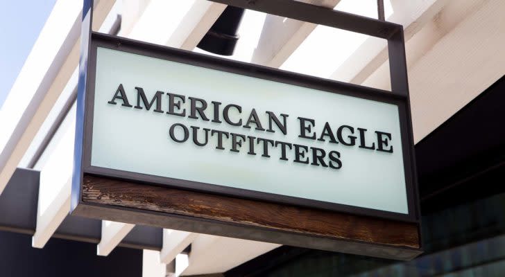 A photo of an American Eagle Outfitters Inc (AEO) sign hanging above a retail storefront entrance.