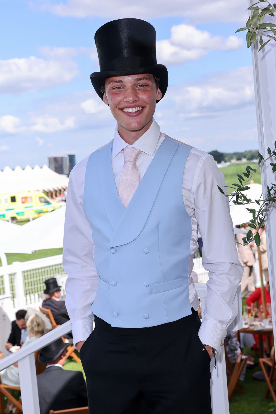 bobby brazier wears a pale blue waistcoat, pink tie and a black top hat at royal ascot racecourse