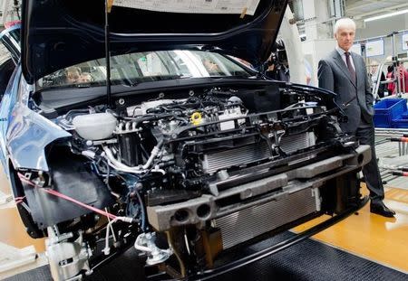 Volkswagen CEO Matthias Mueller looks at the Golf 7 production line during a tour of the VW factory in Wolfsburg, Germany October 21, 2015. REUTERS/Julien Stratenschulte/Pool