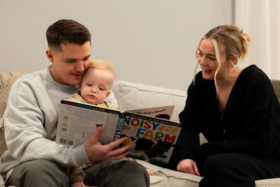 Cole and McCall Porter read a book to their son Jack, 1, at their home in Saratoga Springs on Wednesday, Jan. 31, 2024. | Megan Nielsen, Deseret News