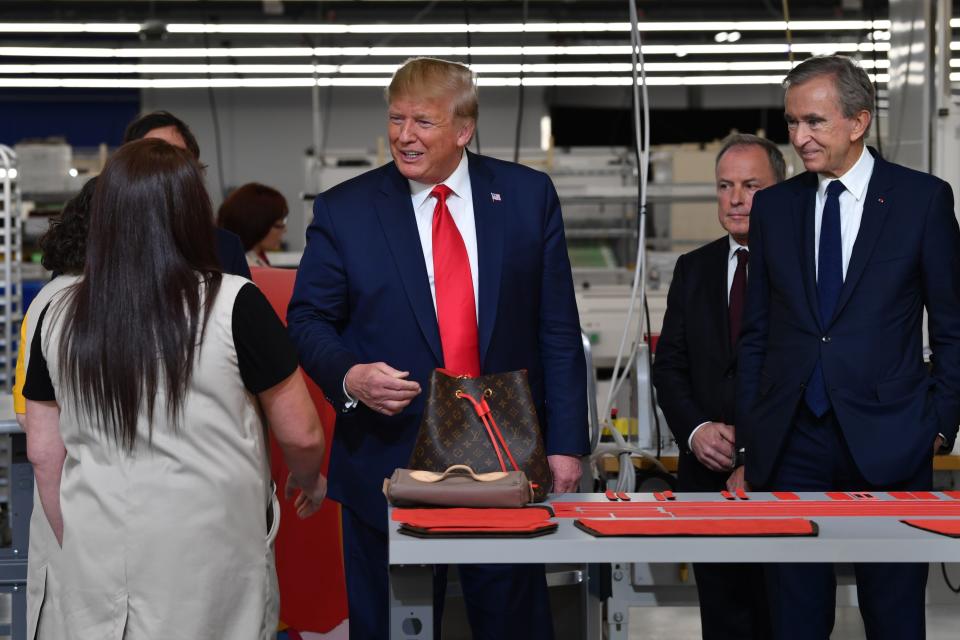 President Donald Trump and LVMH CEO and chairman Bernard Arnault touring Louis Vuitton's new facility in Texas