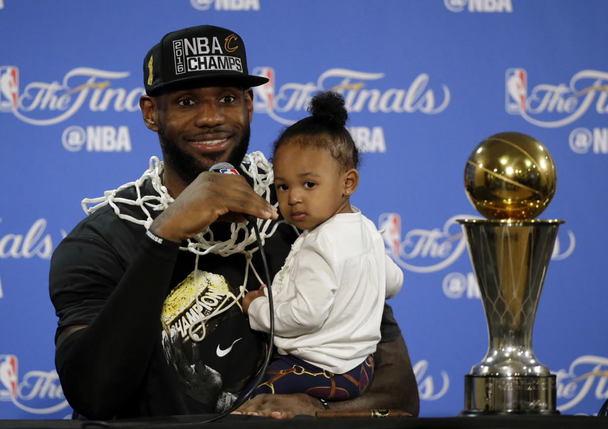 LeBron James with his daughter, Zhuri, after the Cavs won the NBA title in 2016. (AP)