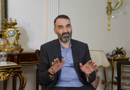 FILE PHOTO: Atta Mohammad Noor, Governor of the Balkh province, gestures as he speaks during an interview in Mazar-i-Sharif, Afghanistan January 1, 2018. REUTERS/Anil Usyan